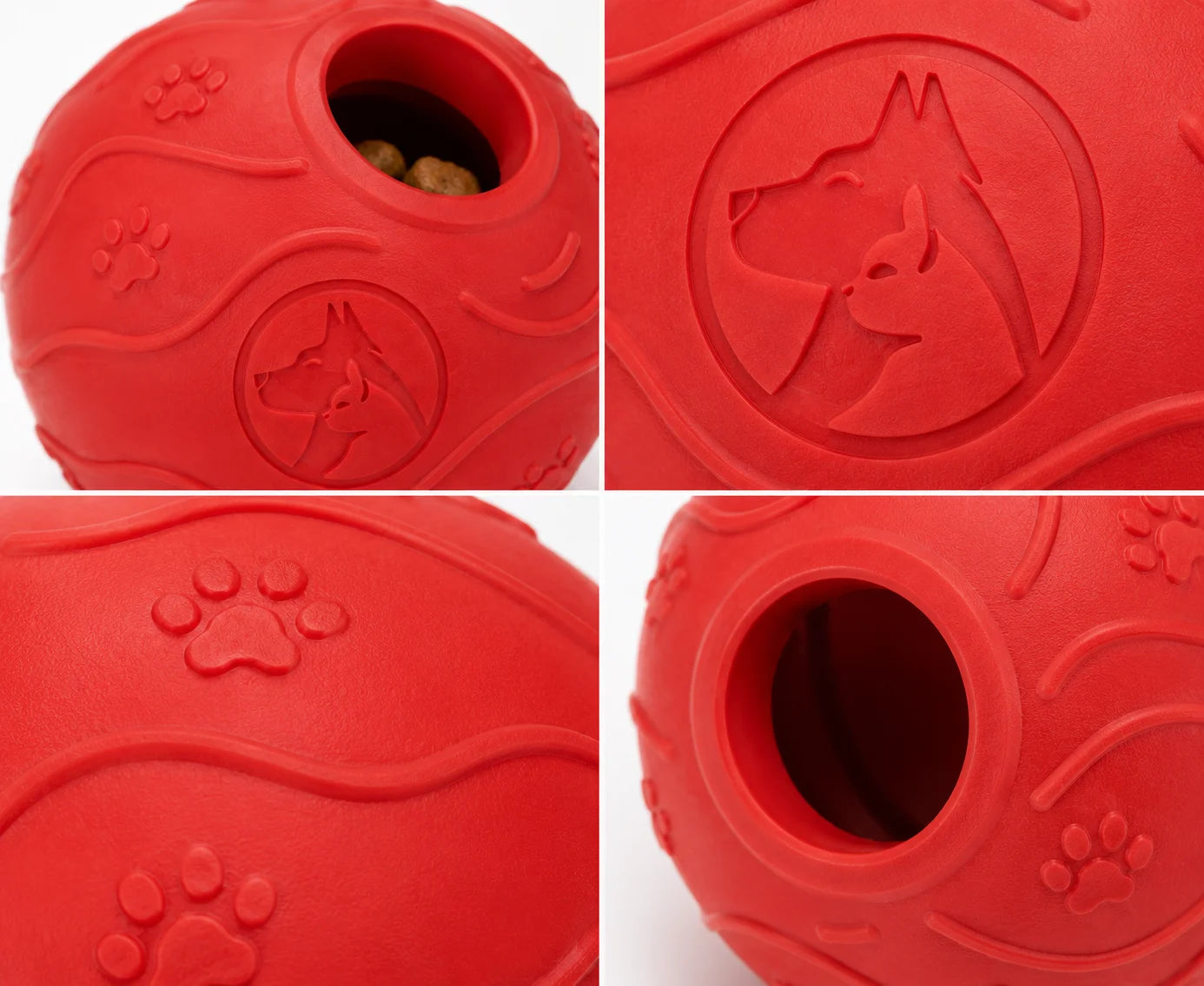 Red rubber dog toy with hole and paw prints on white background closeup