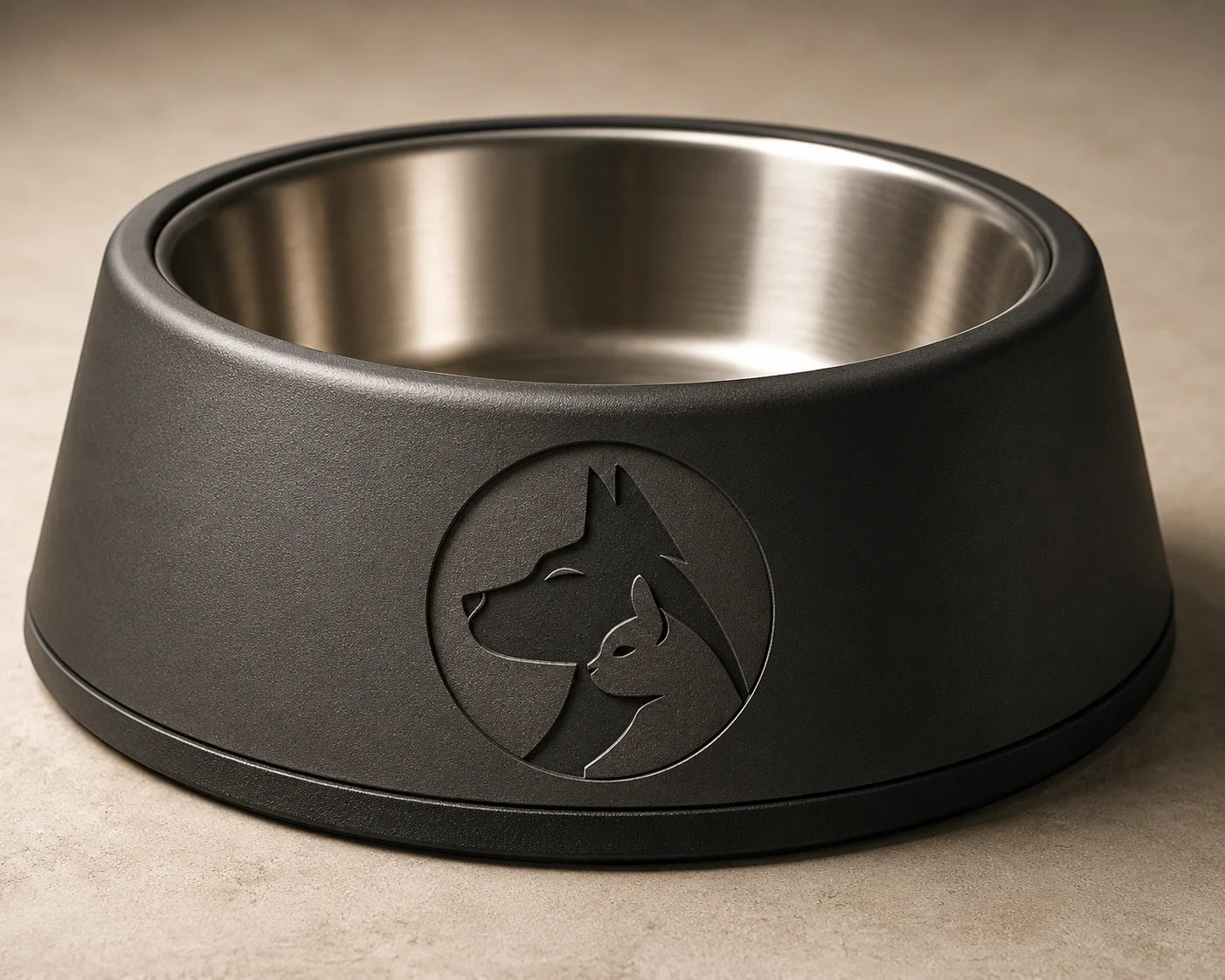Black dog bowl with stainless steel interior and embossed dog and cat design on side